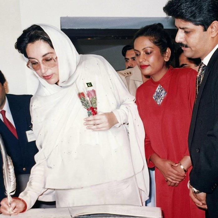 PM Mohtarma Benazir Bhutto signing the visitor's book at PC Hotel stall on the occasion of Tourism Convention '89.